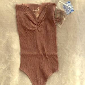 NWT Free People thong bodysuit in grape. Size M/L